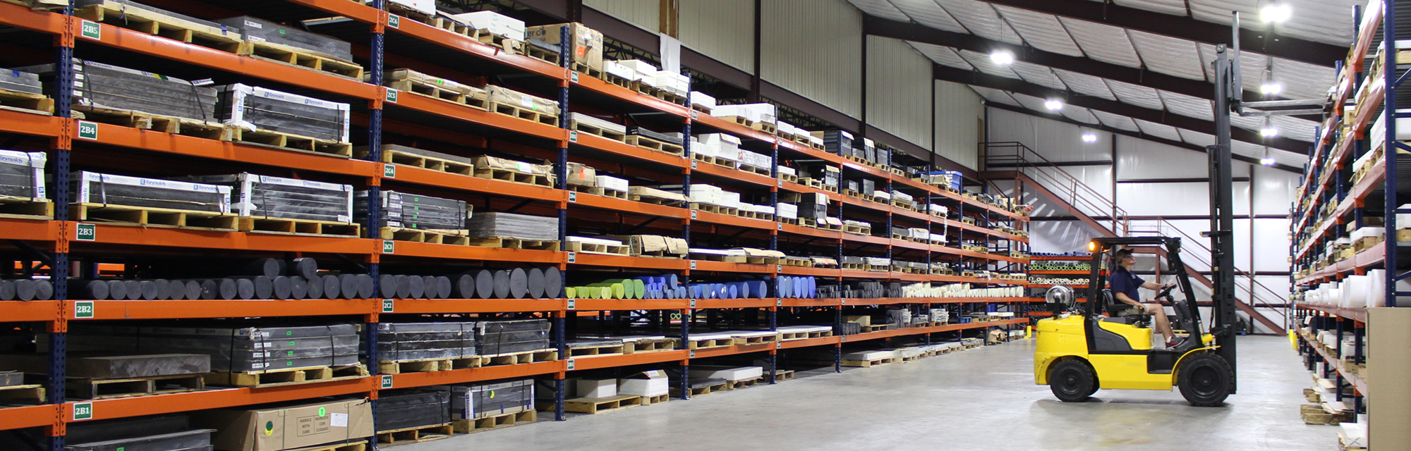 Boedeker Plastics warehouse stocked with plastic sheet, rod and tube