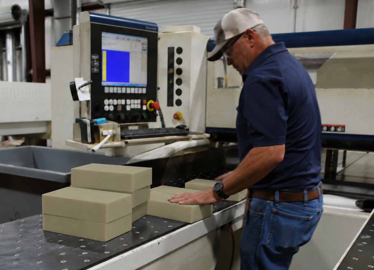 Cut-to-size PEEK sheet staged at a CNC machine at Boedeker Plastics